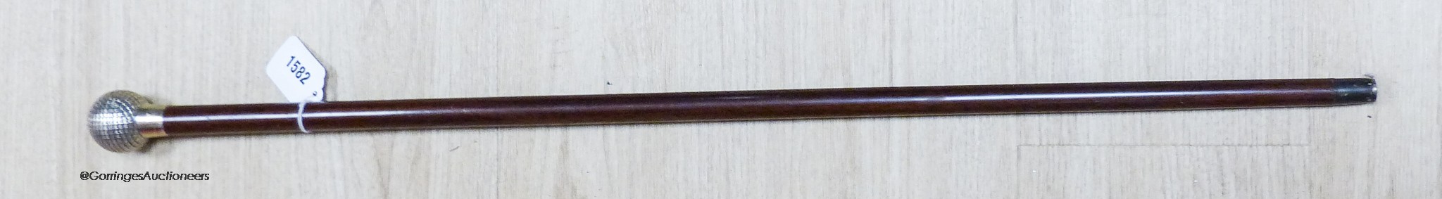 A Briggs silver topped 'golf ball' walking cane, London 1913